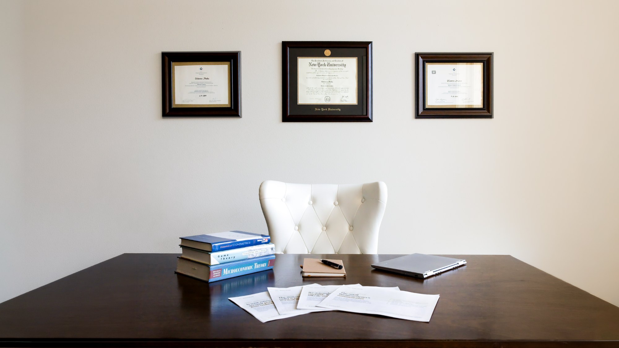 Dr. G’s desk, with her three diplomas on the wall